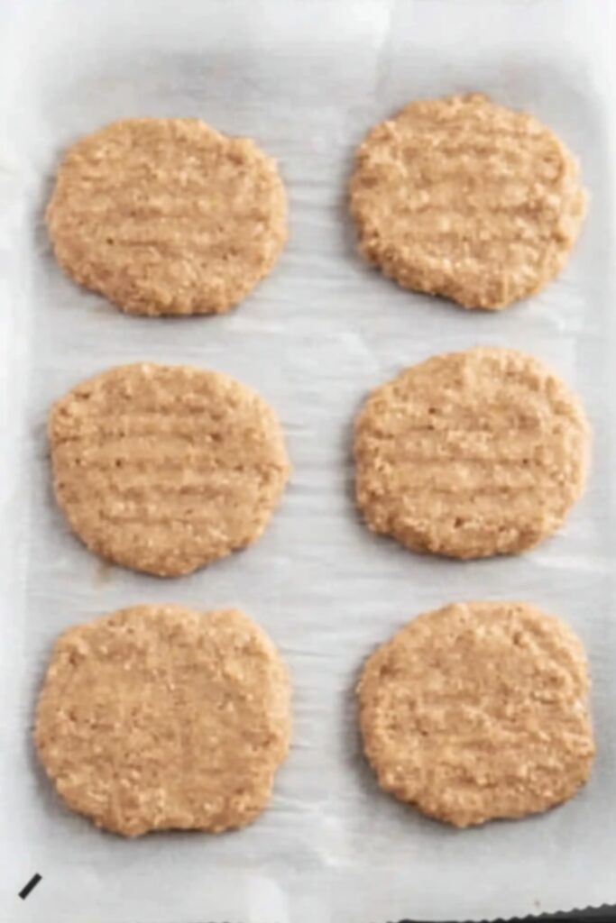 step 3: Press down in the middle of each patty with your thumb to ensure even cooking of the chicken burgers