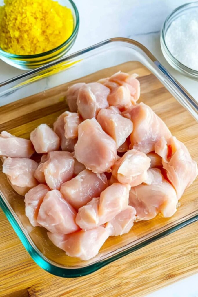 cuting chicken breast into pieces