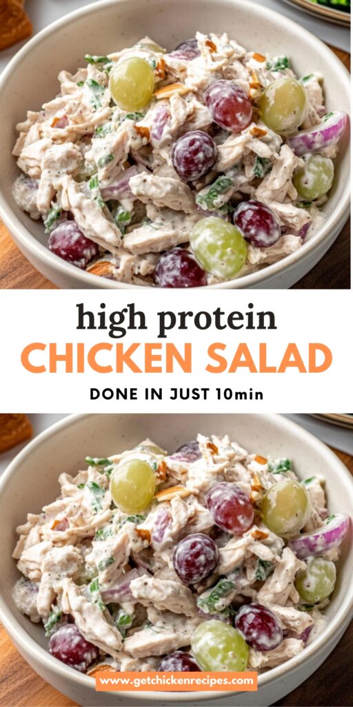A creamy high-protein chicken salad with shredded chicken, red onions, green and red grapes, almonds, and Greek yogurt, served in a bowl.