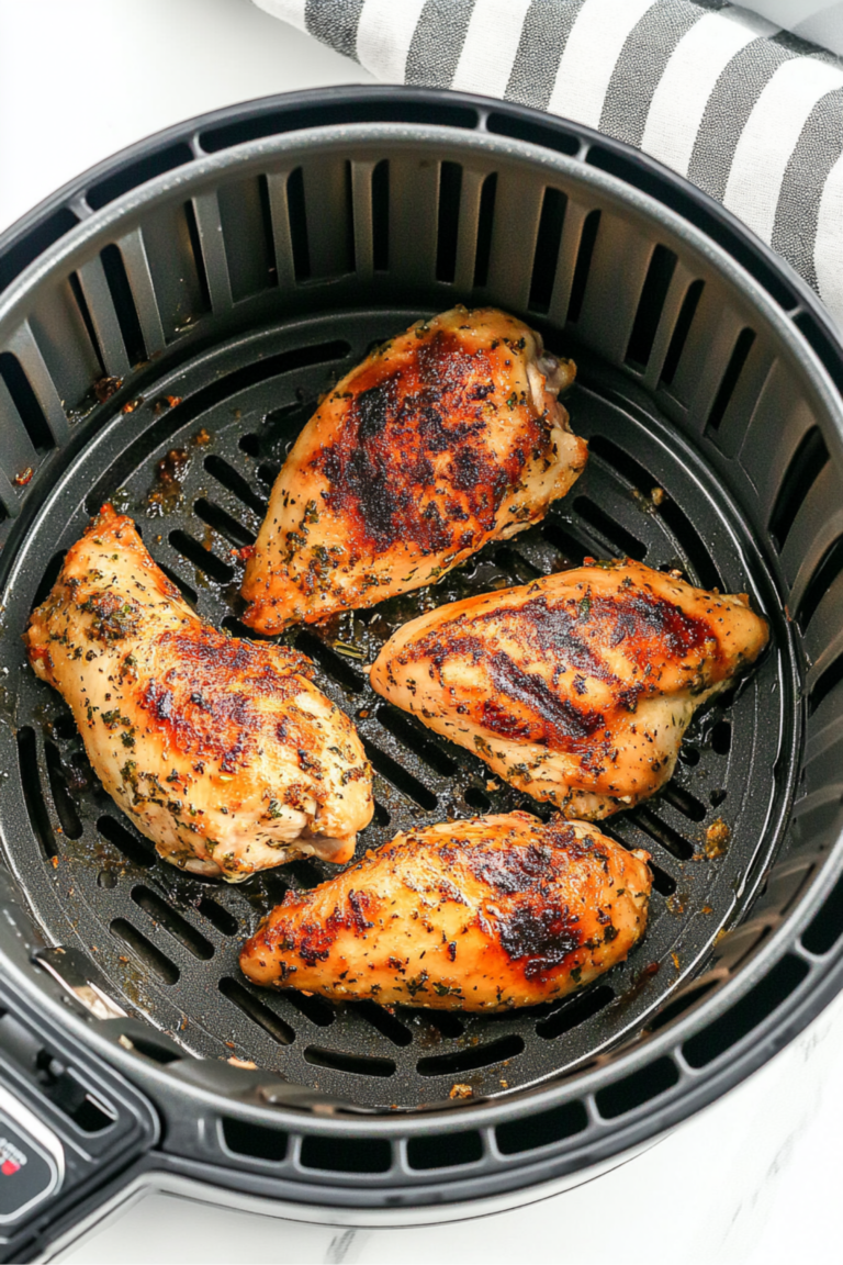 Five golden chicken breasts in air fryer