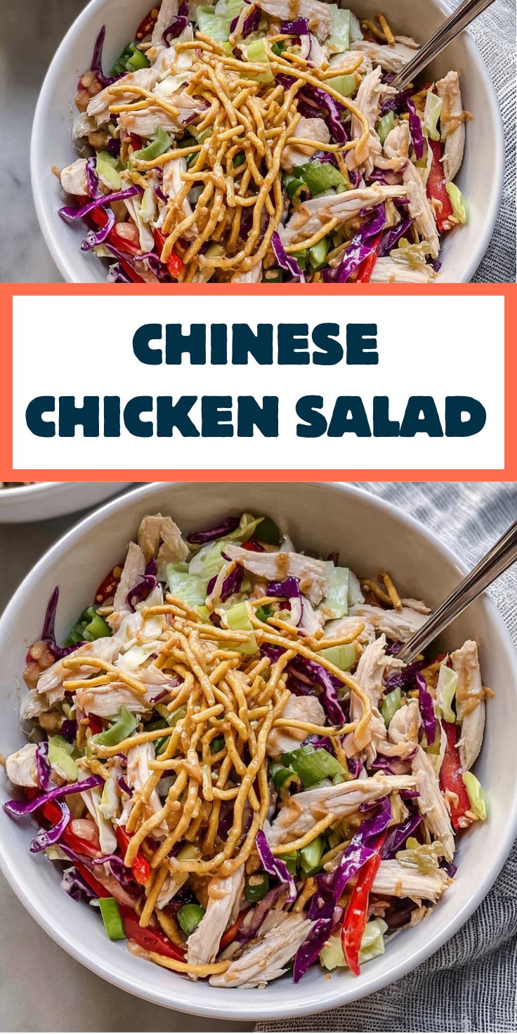 Close-up of Chinese chicken salad with peanut dressing drizzled over shredded chicken and cabbage.